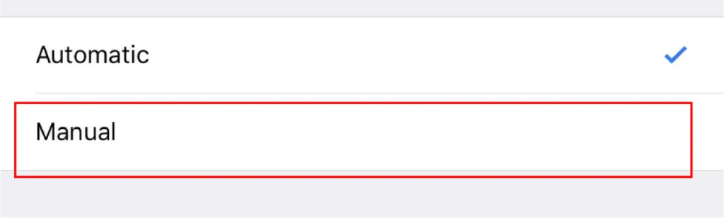 Settings menu with "Automatic" and "Manual" options. The "Automatic" option is selected, while the "Manual" option is highlighted with a red border.